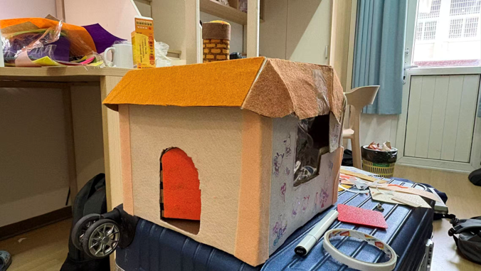 House model with detailed decorative patterns applied